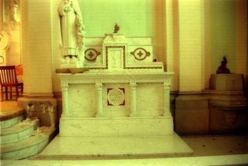 Right side marble altar with inlaid glass mosaics.