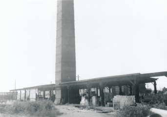 Smokestack and storage sheds, Parker-Russell Mining & Manufacturing Co.